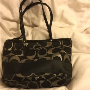 Black and silver coach purse